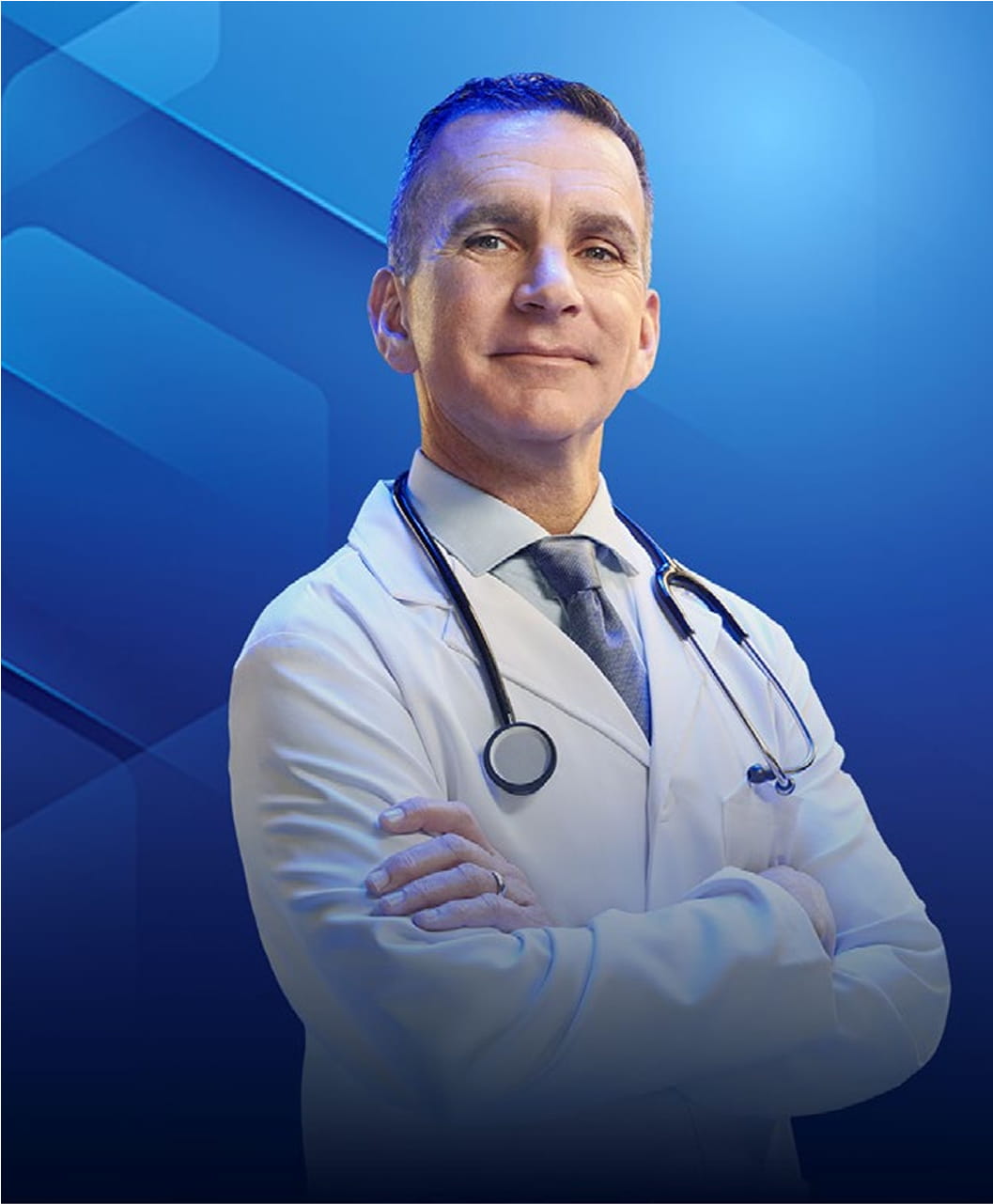 Dr Chuck Vega, MD, in a white coat and stethoscope, smiling with arms crossed.